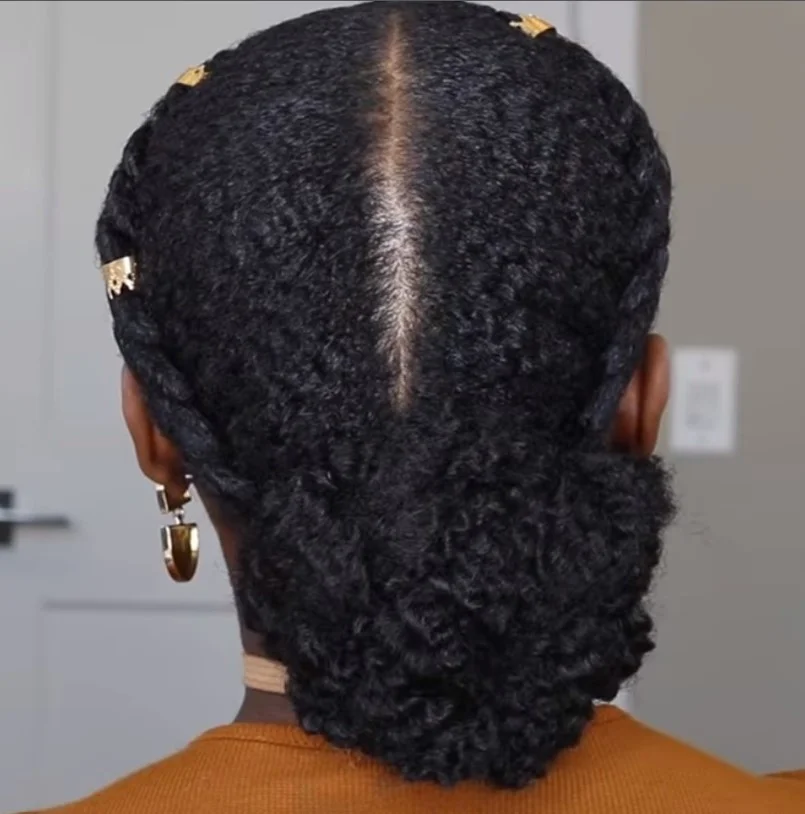 Elegant 2 cornrow braids hairstyles styled into a low bun protective braided updo