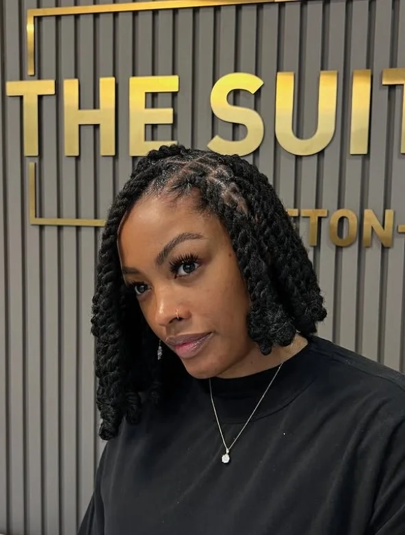 Asymmetrical bob crochet braids with angled silhouette.