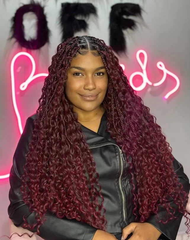 Bohemian crochet box braids hairstyle with loose curly strands.