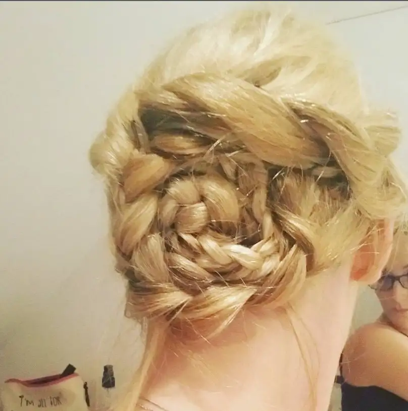 Bridesmaid braids hairstyles Braided Bun With Twists for polished and elegant prom or bridal updos