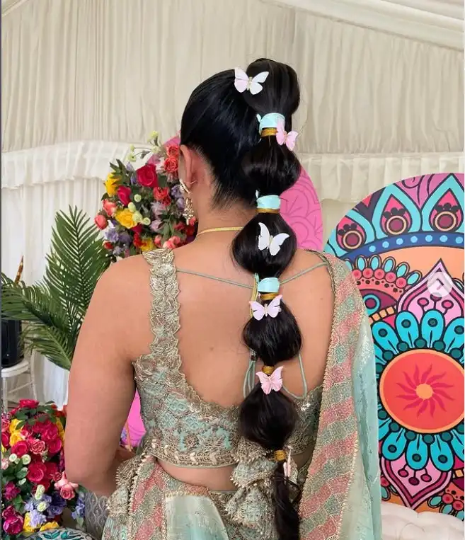 Braided Ponytail With Ribbon prom hairstyle for a playful elegant look