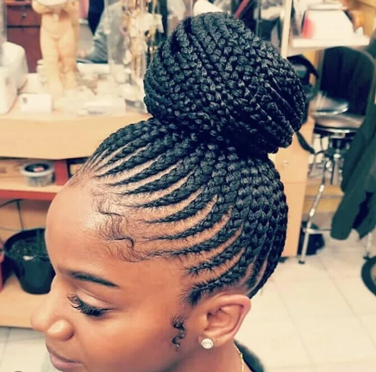 Elegant cornrow bun on black hair for formal occasions and protective styling.