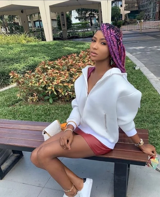 Cornrows in front, box braids in back, protective style