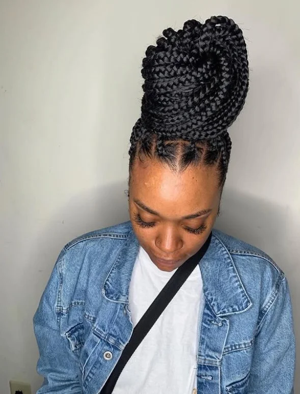 Crochet box braids styled into an elegant braided bun.