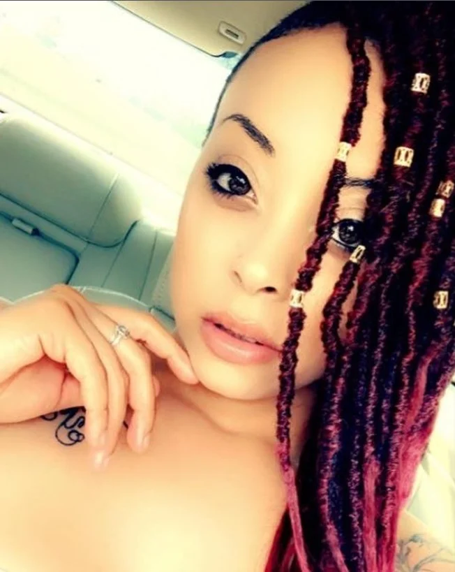 Crochet box braids styled with decorative hair cuffs and rings.