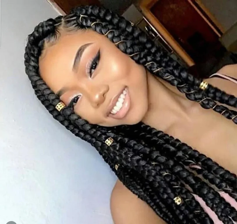 Crochet box braids decorated with beads for a stylish and cultural touch.