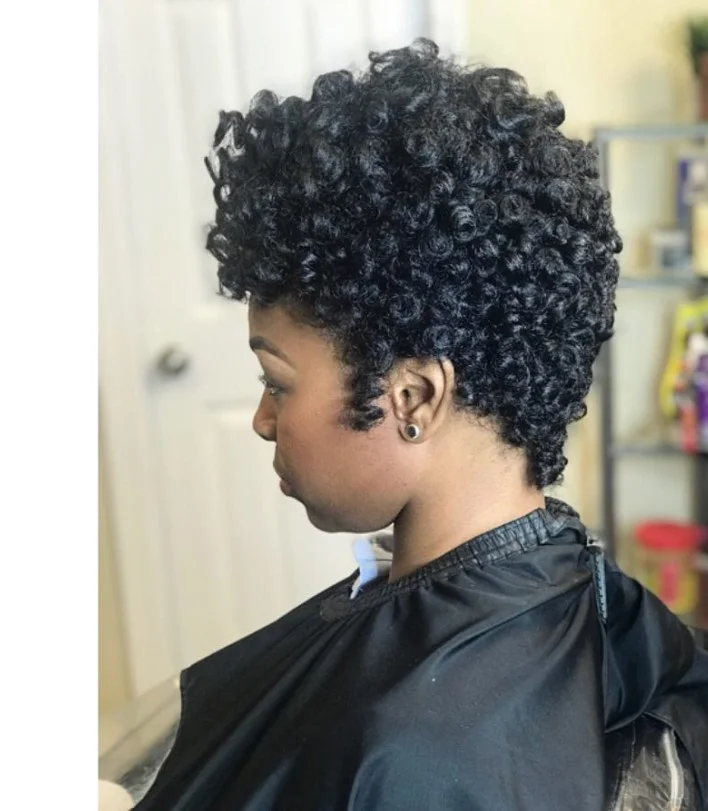 Crochet pixie cut hairstyle with short textured hair and a sleek profile.