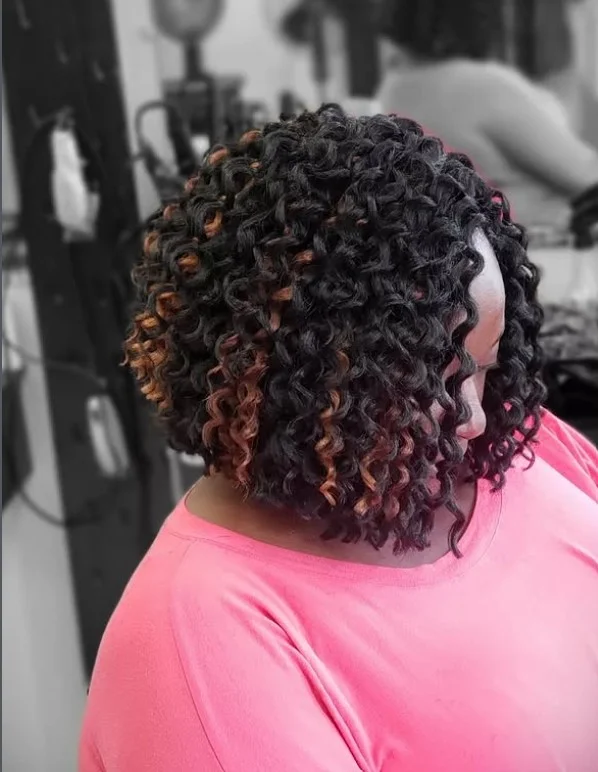 Curly bob crochet braids hairstyle with defined bouncy curls and soft face framing layers