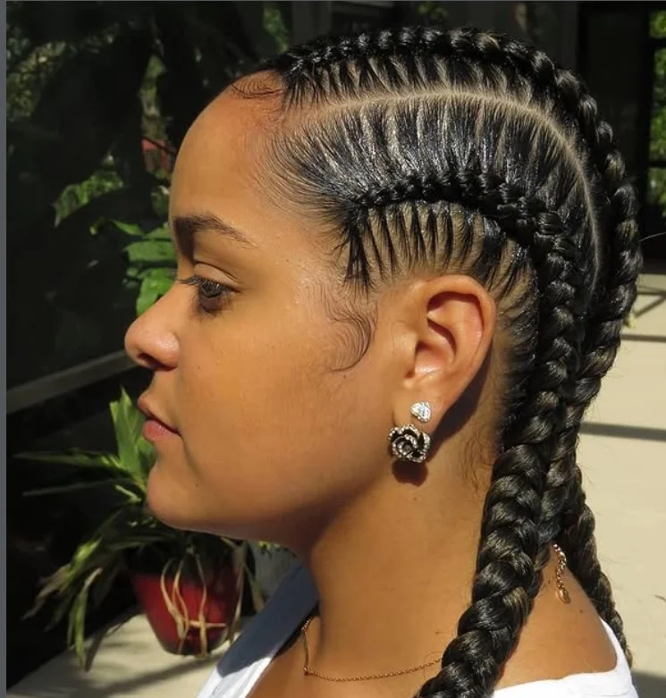 Four feed-in cornrow braids hairstyle with seamless extensions and natural-looking protective style