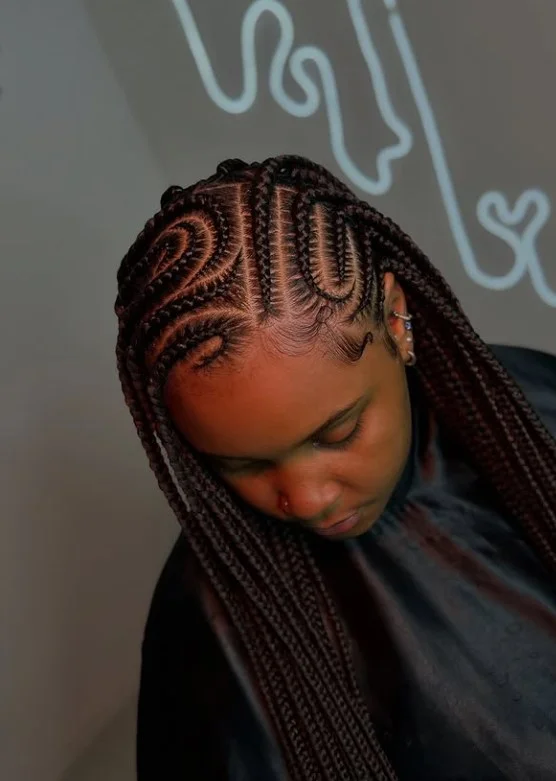 African cornrow braids hairstyles Fulani cornrows with center braid and decorative beads protective style