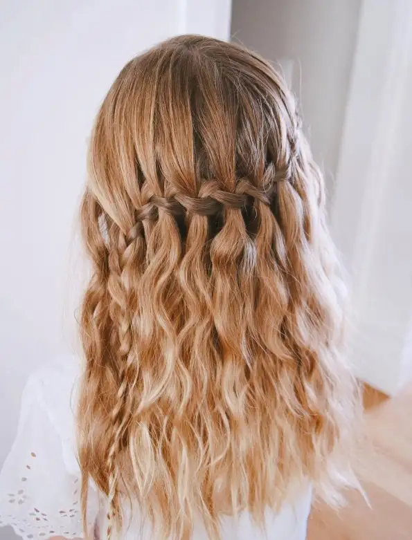 Bridesmaid braids hairstyles Half-Up Waterfall Braid for flowing and whimsical prom and bridal looks