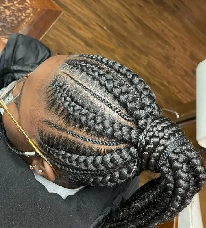 Large cornrows protective hairstyle idea