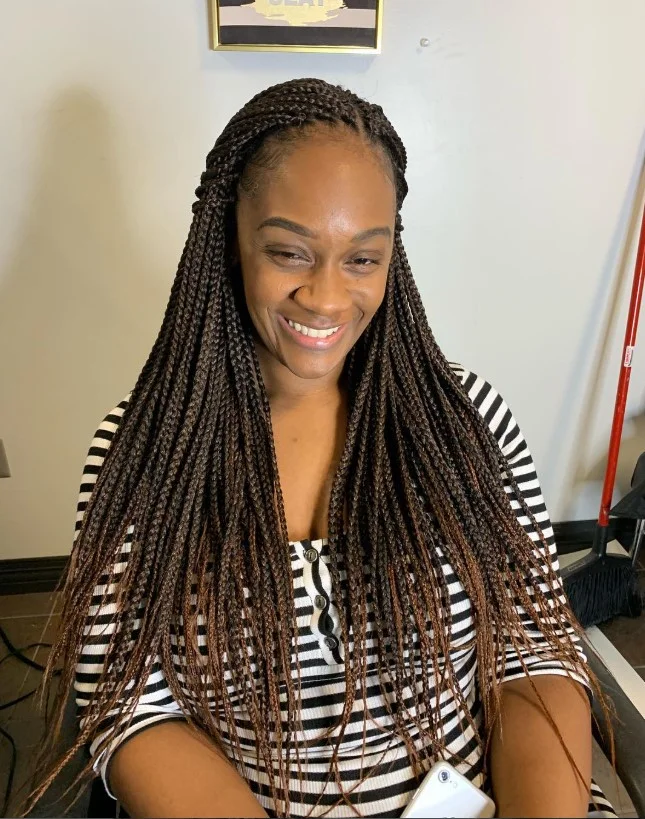Micro crochet box braids hairstyle with thin, detailed braid sections.