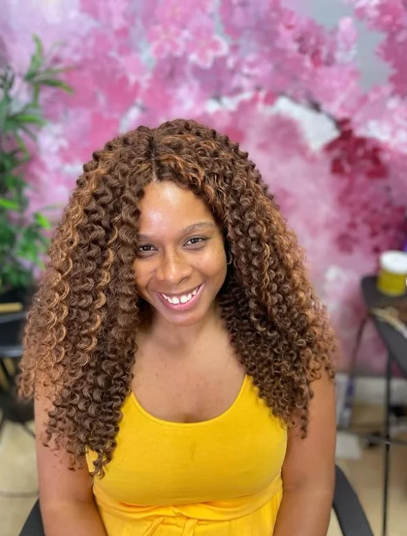 Middle-part short crochet bob hairstyle with smooth center part.