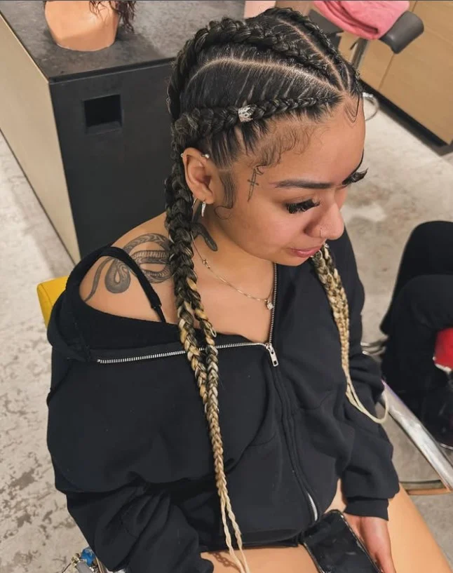 Minimalist 4 cornrow braids hairstyle with even spacing and sleek natural finish