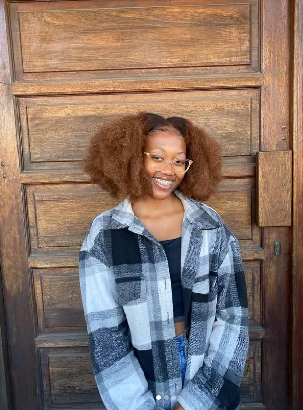 Short afro crochet braids with a full rounded natural shape.