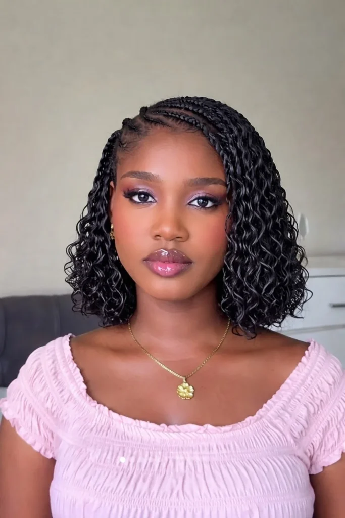 Short goddess crochet braids with elegant curls and goddess texture.
