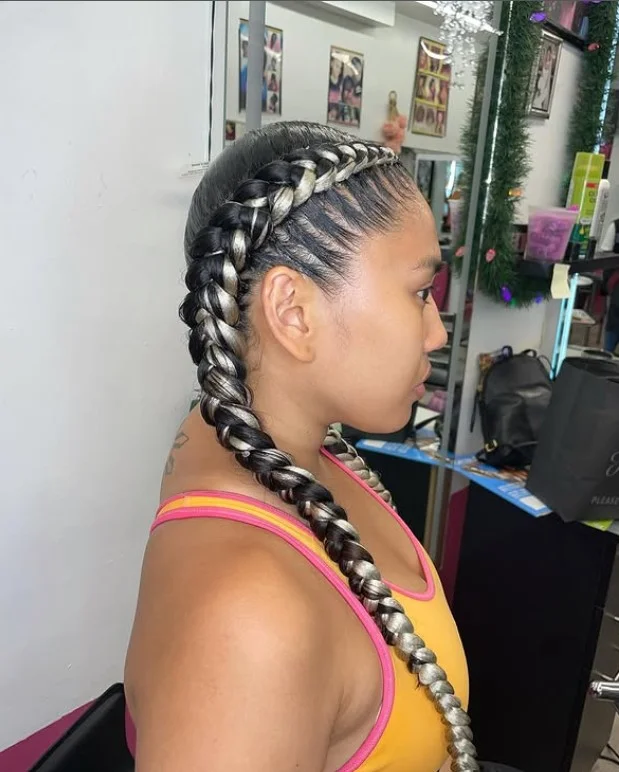 Side-part 2 cornrow braids hairstyles with deep scalp parting and modern double braid design