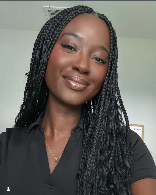 Crochet box braids styled with a deep side part for added dimension.