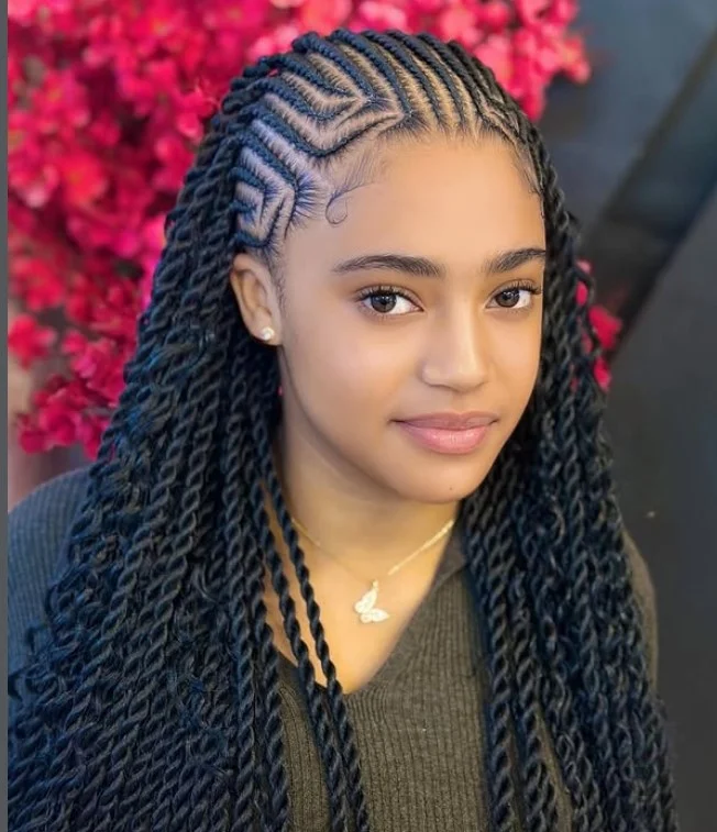 Black hair cornrow braids in tribal-inspired patterns for cultural statement style.