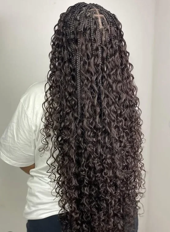 Extra-long waist-length crochet box braids styled in a sleek protective look.