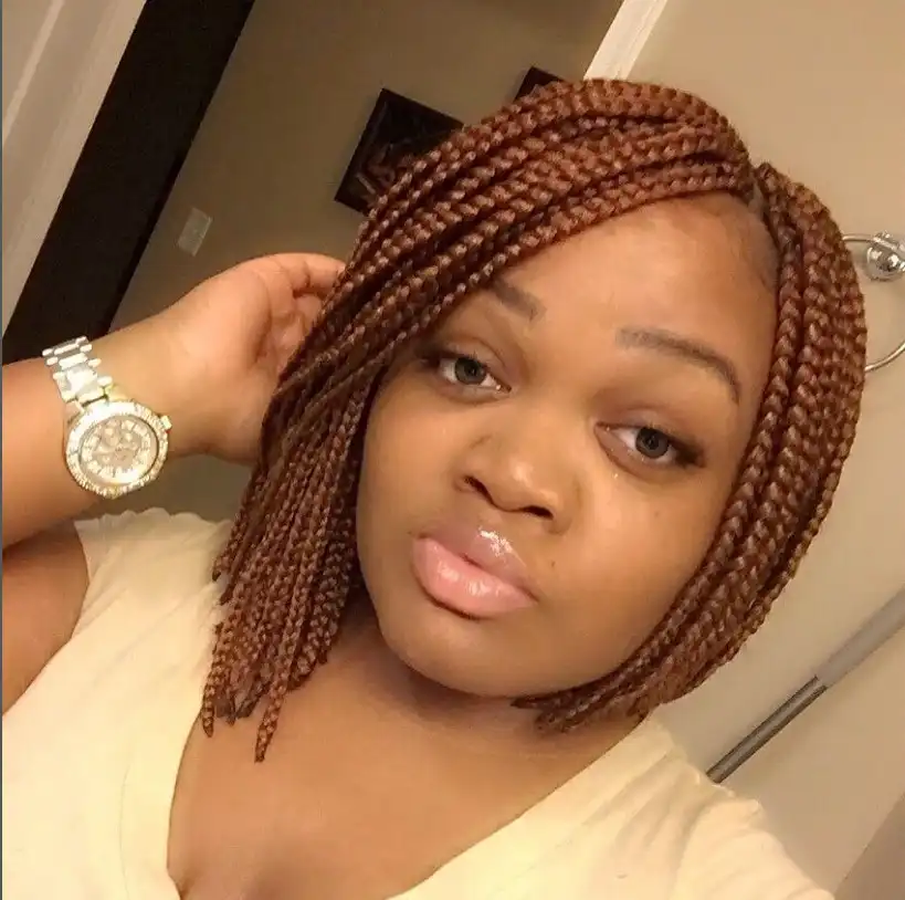 Edgy asymmetrical bob braids hairstyle 2026 with longer braids on one side creating a modern fashion-forward braided bob.