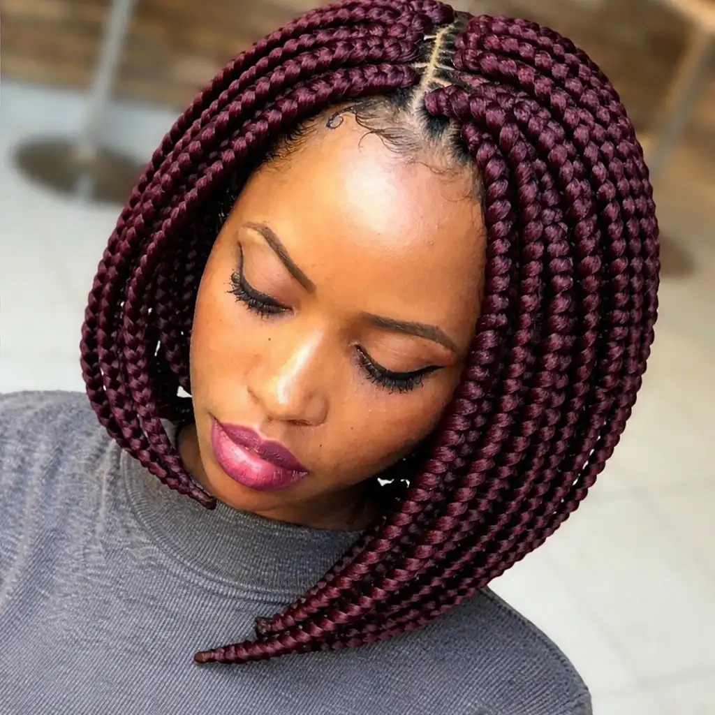 short bob braids hairstyles asymmetrical braided bob haircut with longer braids on one side creating a modern edgy style