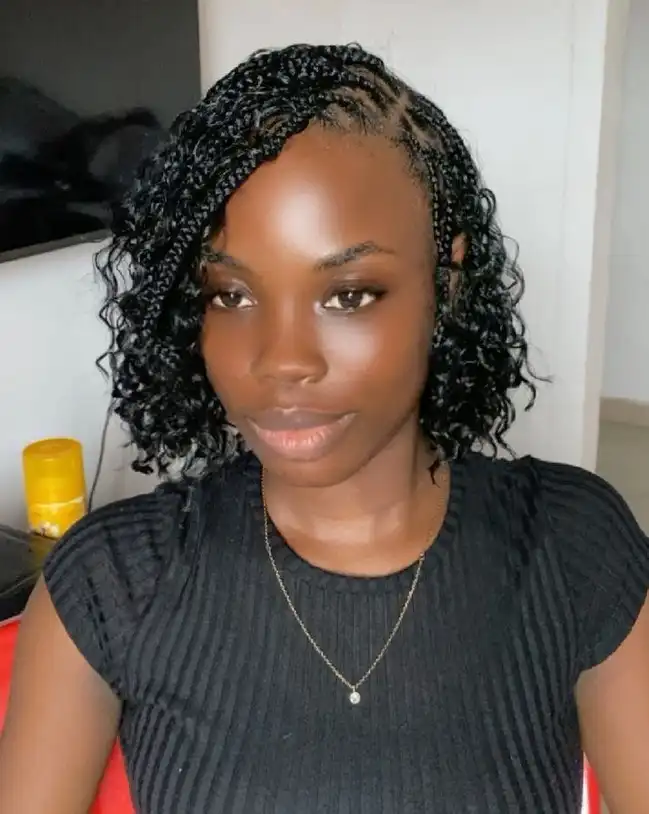 Curly end bob braids hairstyles 2026 with soft curls adding volume and texture to a stylish protective braided bob haircut.