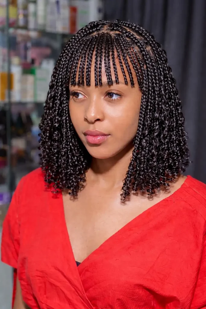 Chic bob braids hairstyle with fringe 2026 featuring braided bangs framing the face for a soft and stylish braided bob look.