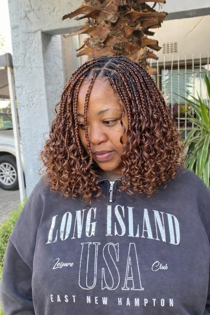 Soft wavy bob braids hairstyle 2026 with loose waves, adding texture and movement to a stylish braided bob.