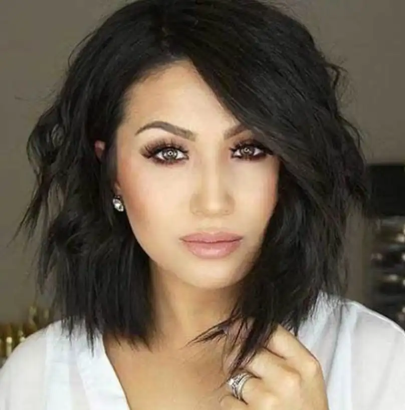 Choppy shoulder length layered hairstyle with side bangs edgy style