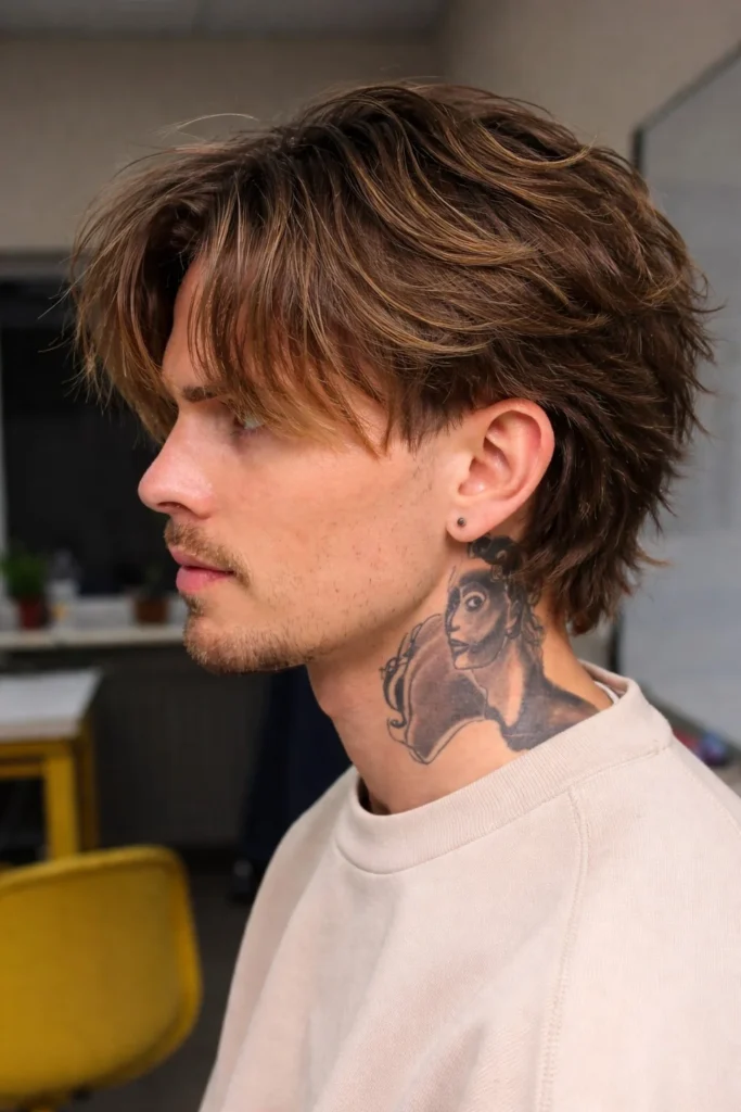Choppy layered hairstyle with long fringe for men