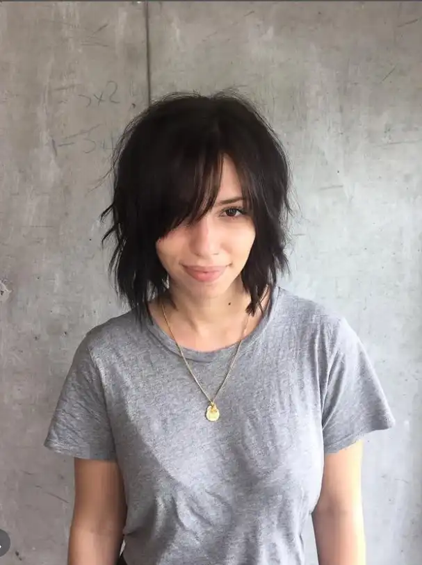 Choppy shag cut with wispy strands enhancing movement