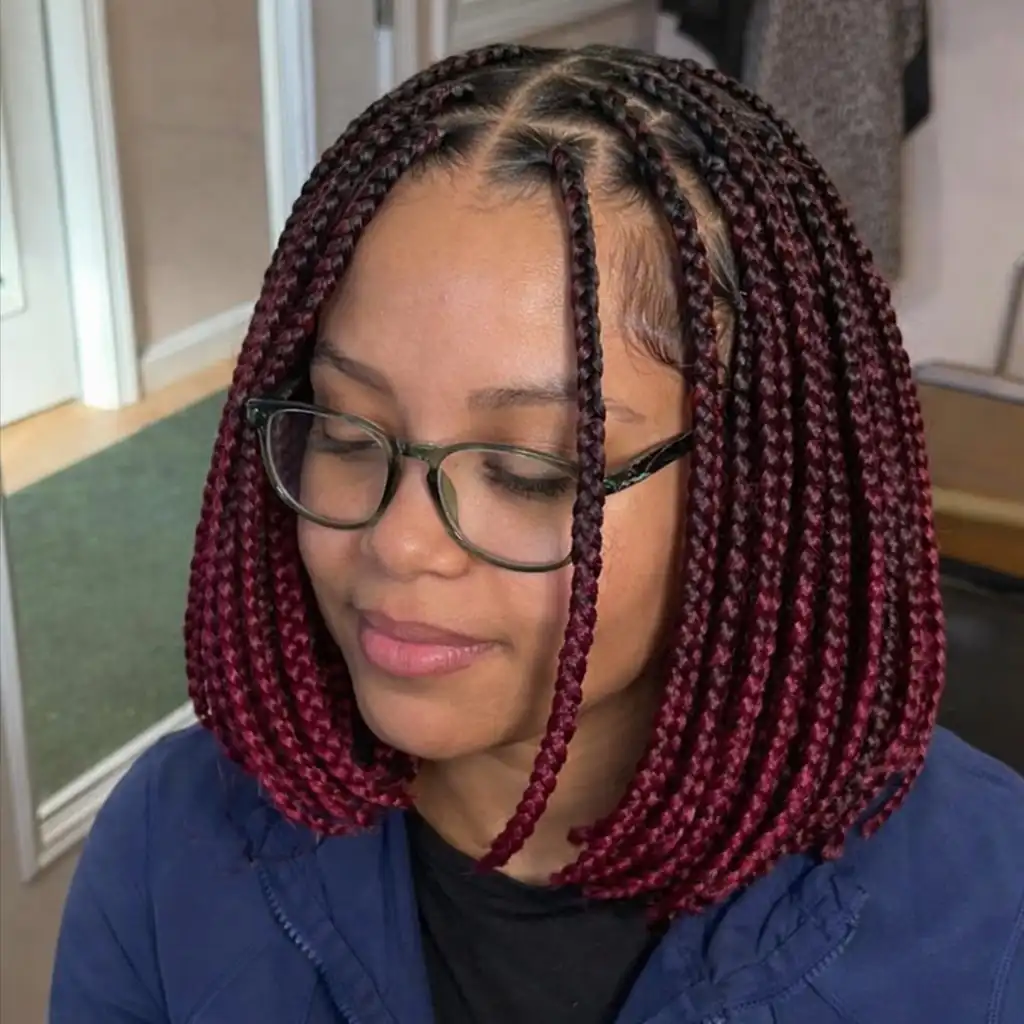 short bob braids hairstyles colored braided bob haircut with vibrant hair extensions creating a bold protective braid look