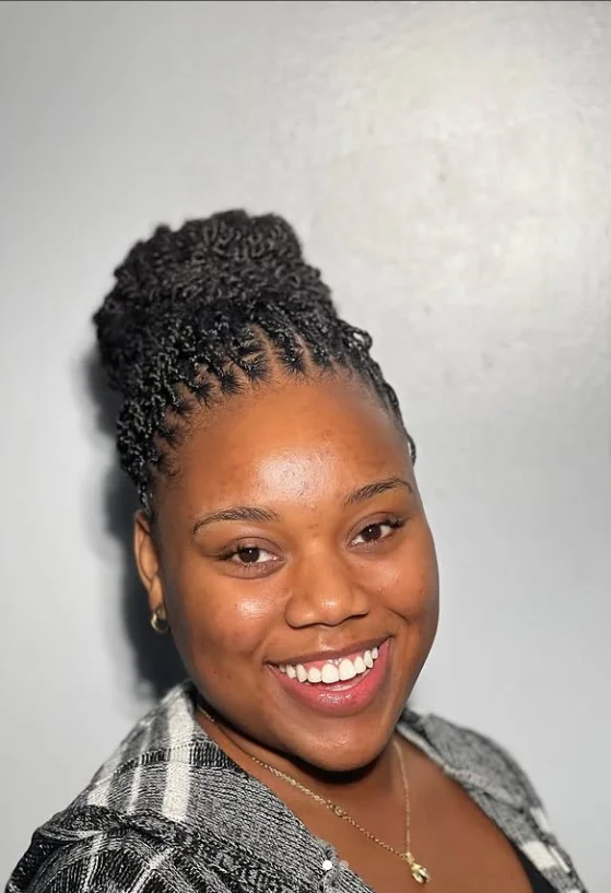 Crochet twist braids styled in a high bun.