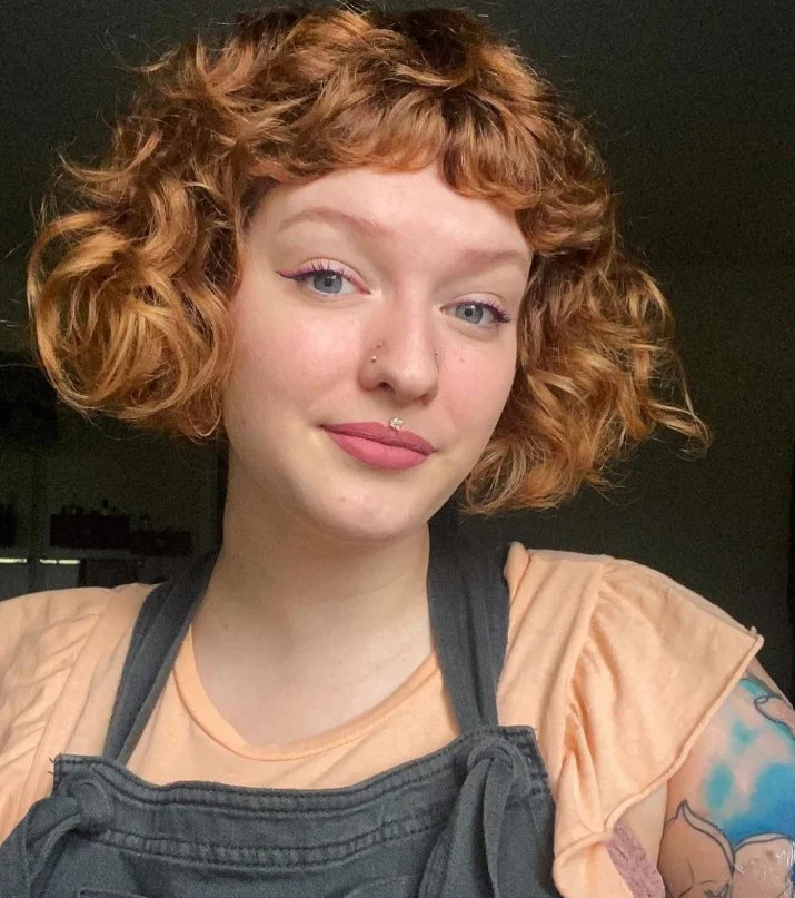 Curly bob with soft face-framing fringe