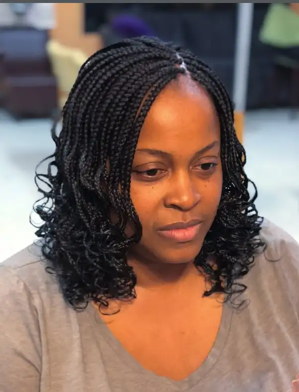 curly end bob box braids hairstyles with soft curled tips creating a playful braided bob protective hairstyle