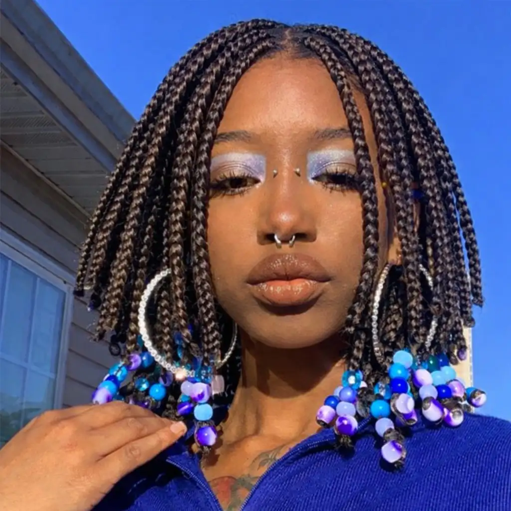 layered bob box braids hairstyles with textured braid layers creating movement in a fashionable braided bob