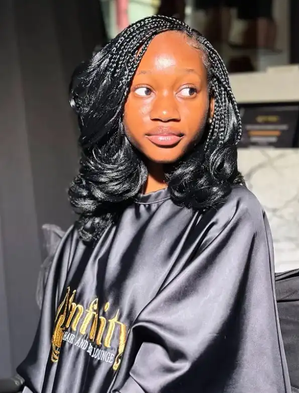 Textured layered bob braids hairstyle 2026 with dimensional braided layers adding movement to a stylish braided bob haircut.