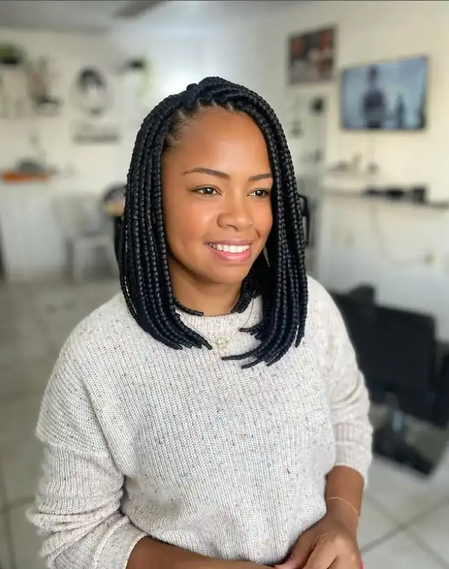Shoulder-length long bob braids hairstyle 2026 with sleek braided strands offering a stylish and versatile protective hairstyle.