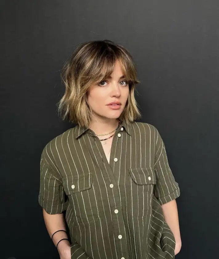 Lucy Hale choppy bangs with uneven texture, adding a fun, edgy vibe and movement to a casual, youthful hairstyle.