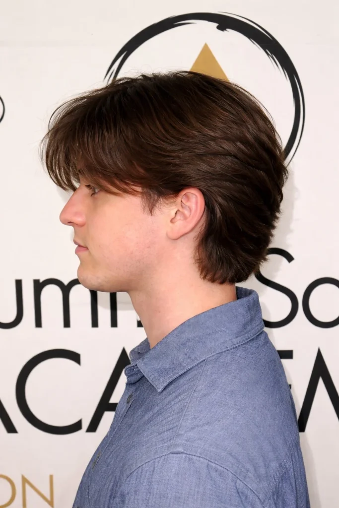 Medium length flow hairstyle with long bangs for men