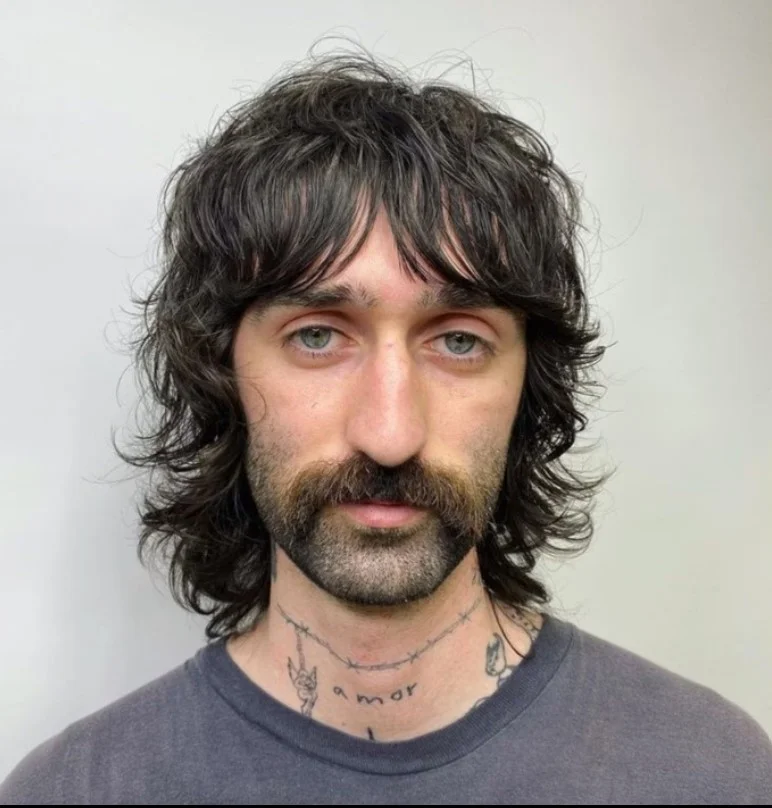 Messy layered haircut for guys with long bangs