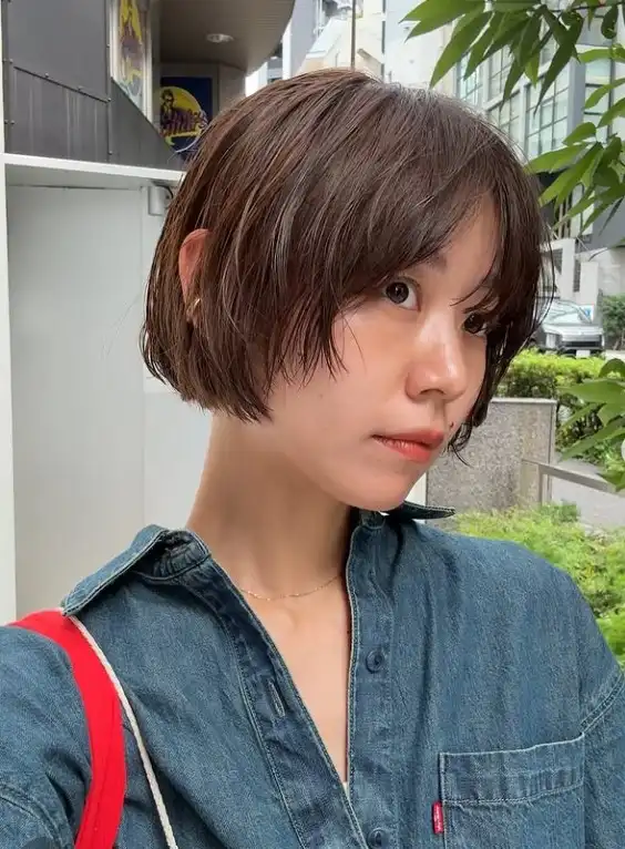 Mini bob with airy fringe on short hair
