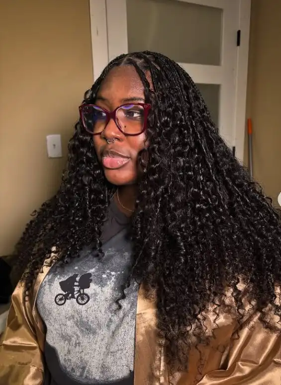 Natural-look wavy crochet braids protective hairstyle.