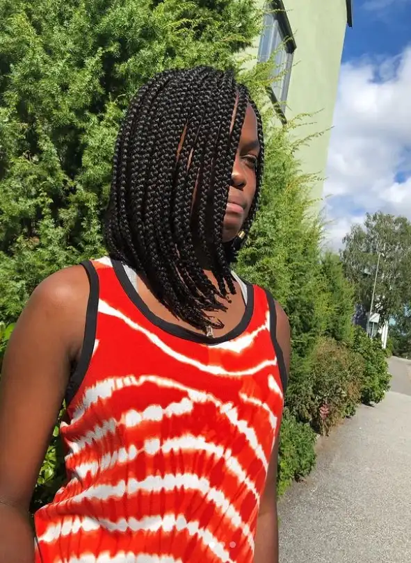 Trendy ombre bob braids hairstyle 2026 featuring blended hair colors creating a fashionable braided bob protective style.