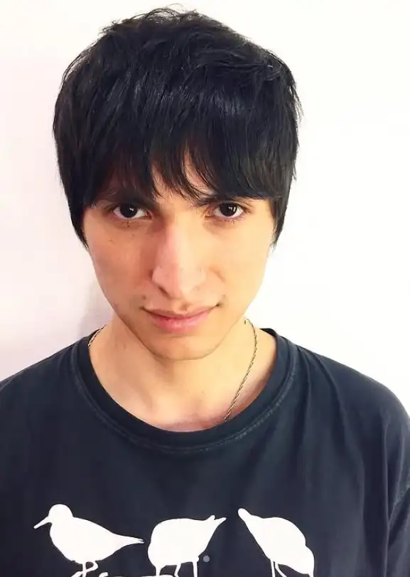 Shaggy haircut for guys with long bangs and layers