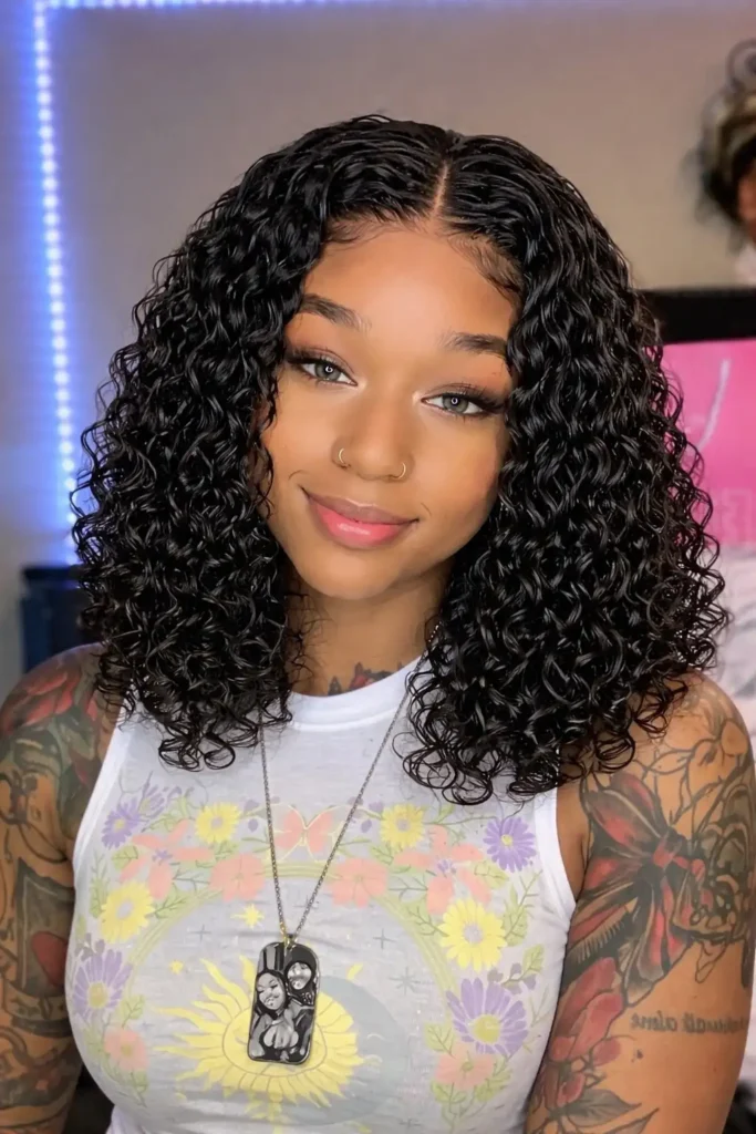 Shoulder-length water wave crochet braids style.