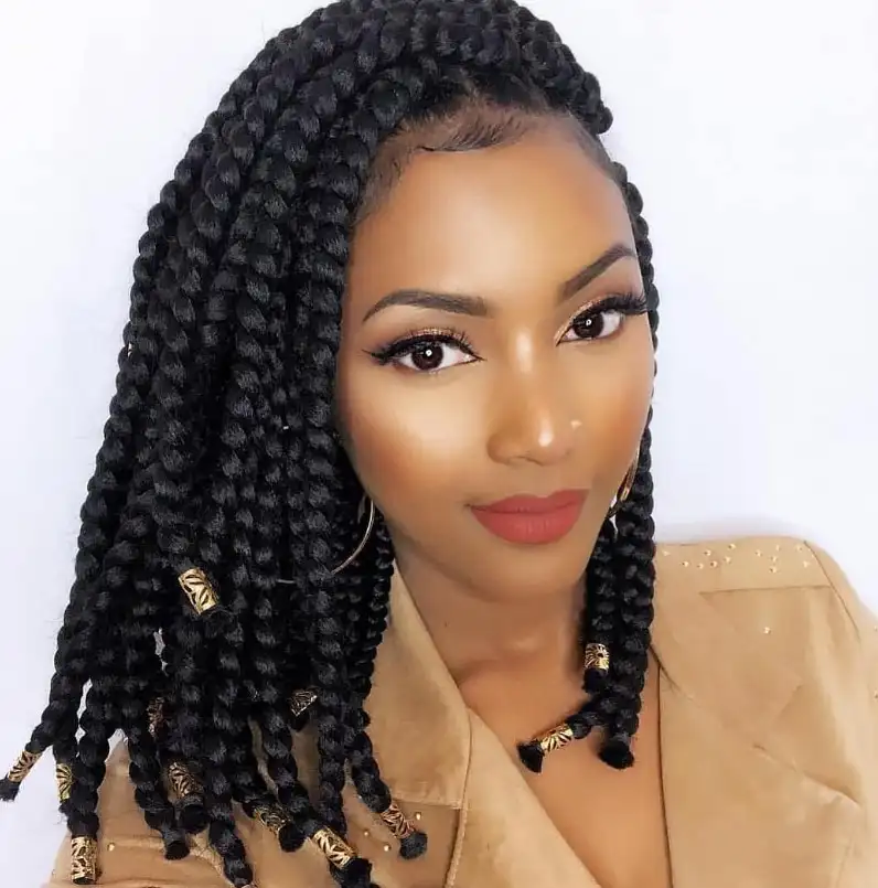 side part bob box braids hairstyles featuring a deep side part creating volume in a stylish braided bob