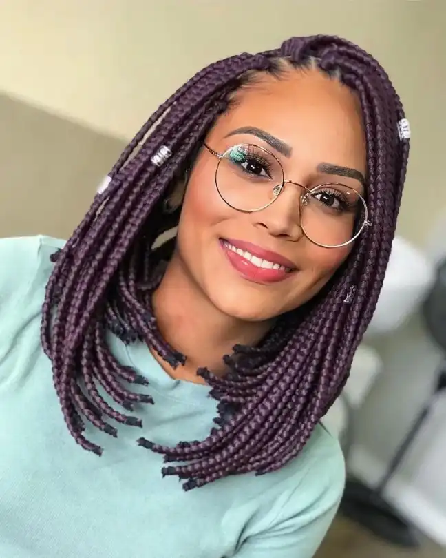 short bob braids hairstyles with deep side part creating a stylish braided bob haircut with added volume and face framing shape